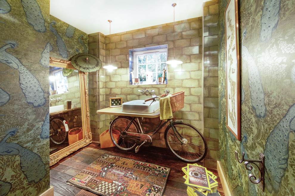Inspiration for an eclectic dark wood floor and brown floor powder room remodel in Hampshire with multicolored walls and a vessel sink