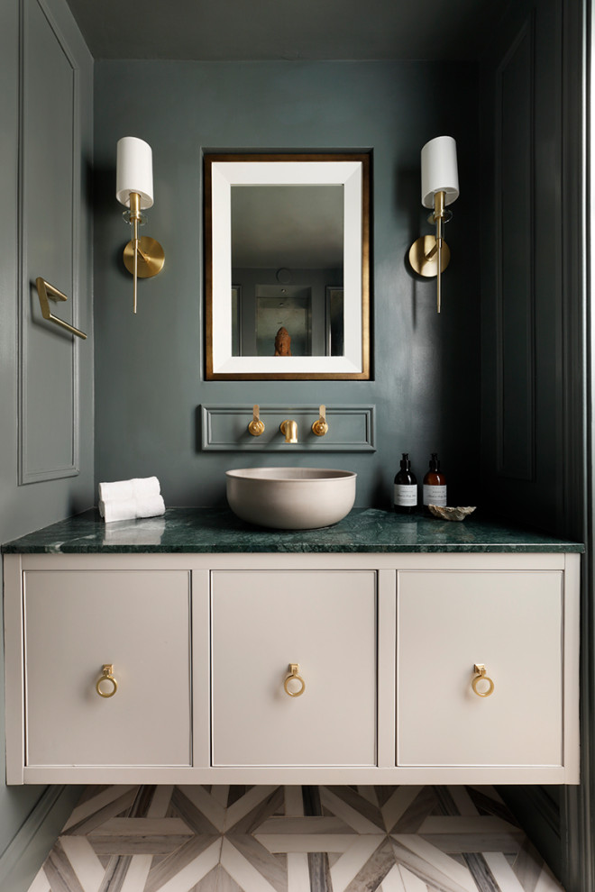 Inspiration for a transitional powder room remodel in London with green cabinets and marble countertops