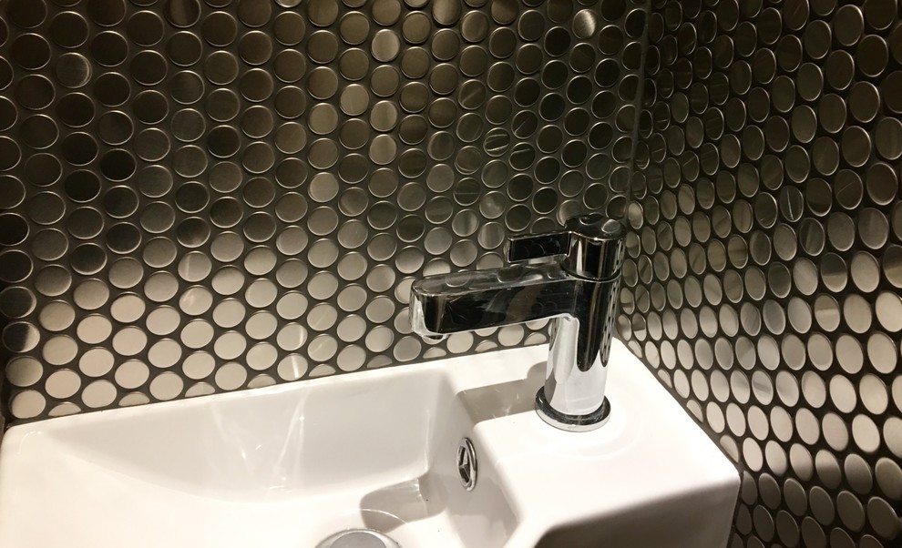 Design ideas for a small contemporary cloakroom in Surrey with grey tiles, mosaic tiles, grey walls, ceramic flooring and a wall-mounted sink.
