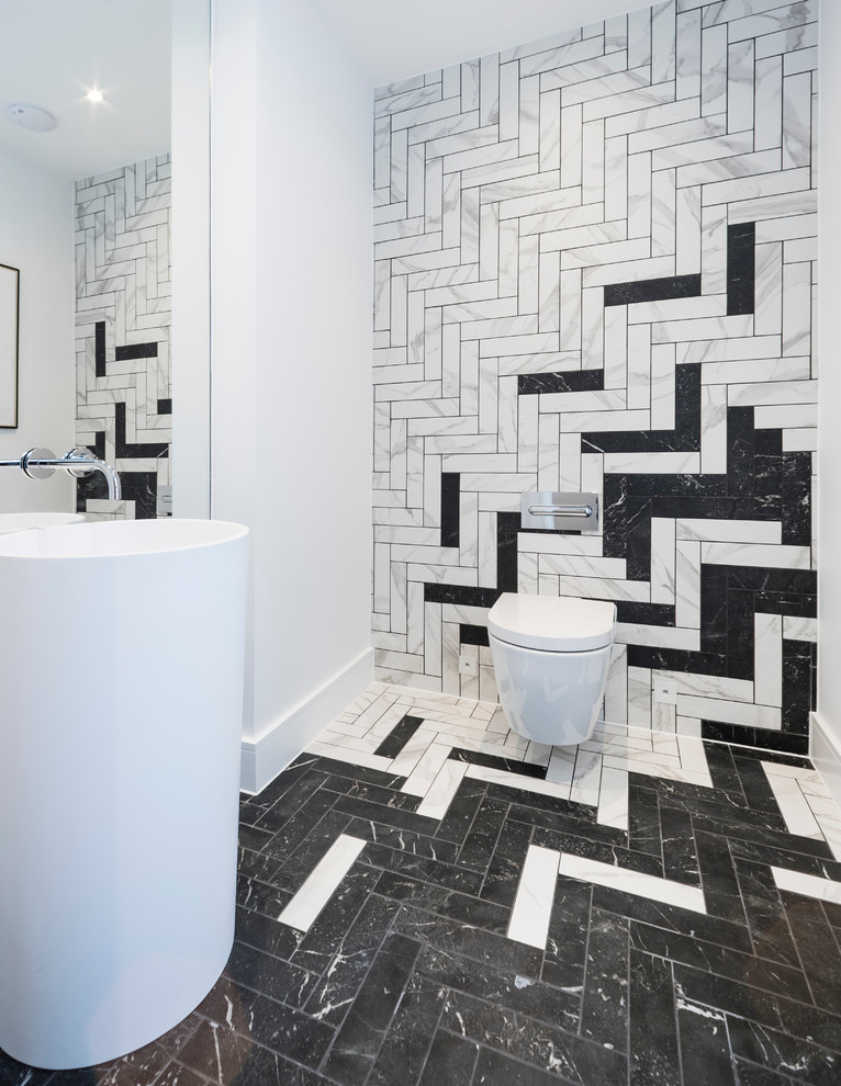 Inspiration for a contemporary cloakroom in Dorset with a wall mounted toilet, black tiles, black and white tiles, multi-coloured tiles, white tiles, multi-coloured walls, a pedestal sink, multi-coloured floors, marble tiles and marble flooring.