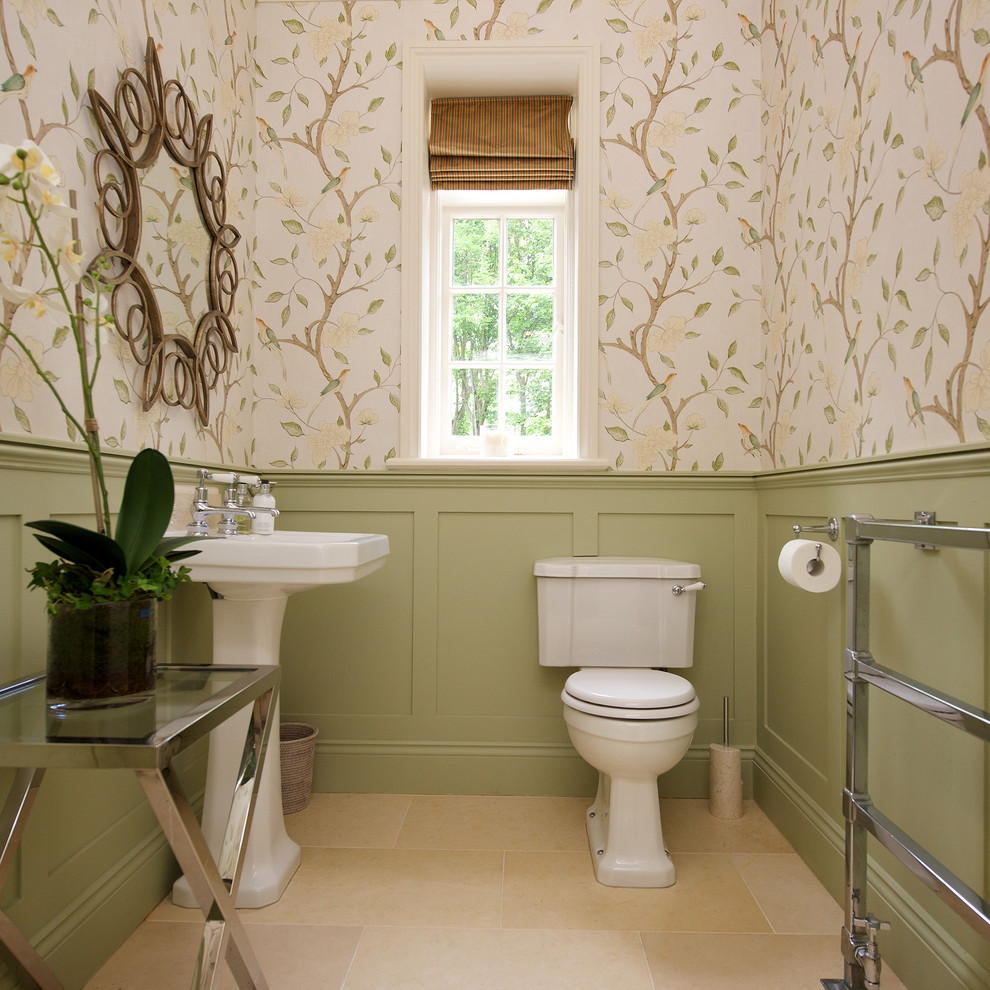 Elegant powder room photo in Other with a pedestal sink, a two-piece toilet and multicolored walls