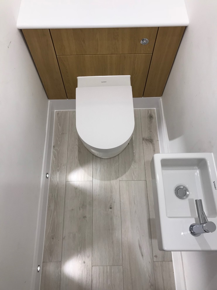 Design ideas for a contemporary cloakroom in Surrey.