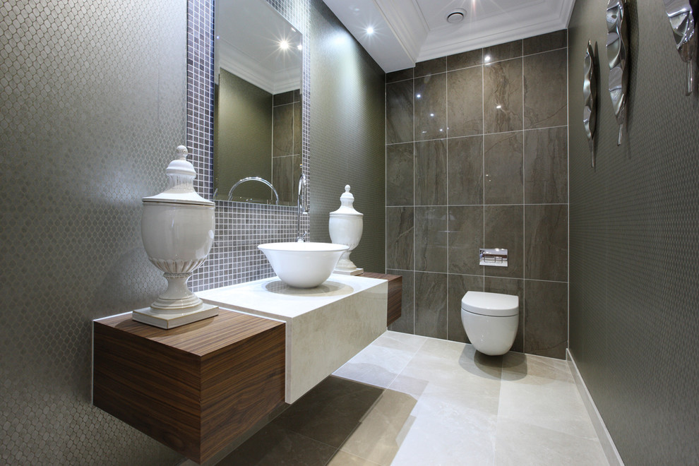 Small trendy brown tile and mosaic tile porcelain tile and white floor powder room photo in London with green walls