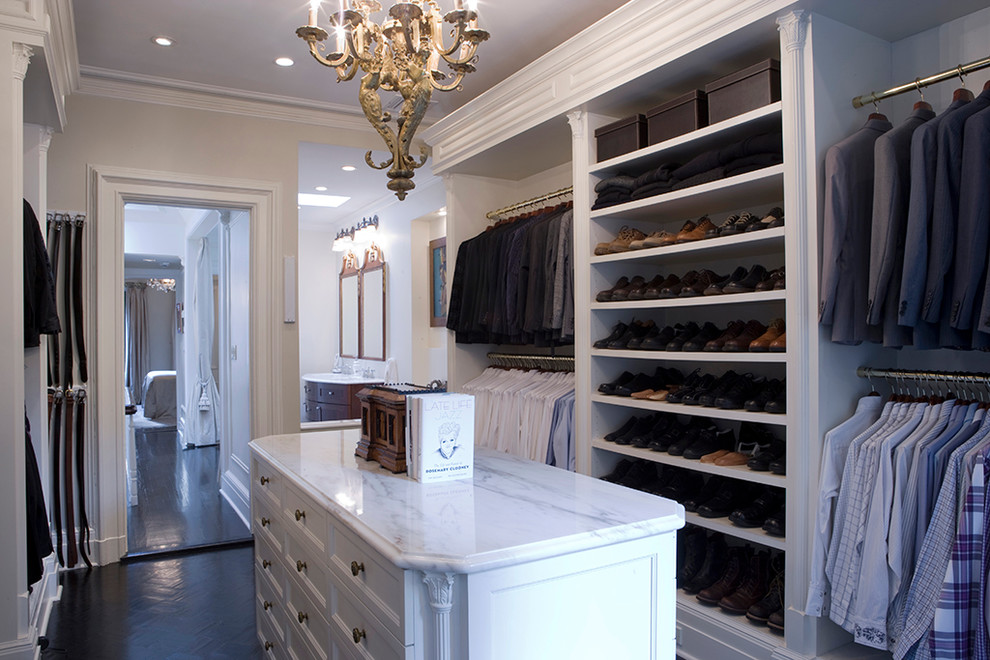 Dressing room - traditional men's dark wood floor dressing room idea in New York with open cabinets and white cabinets
