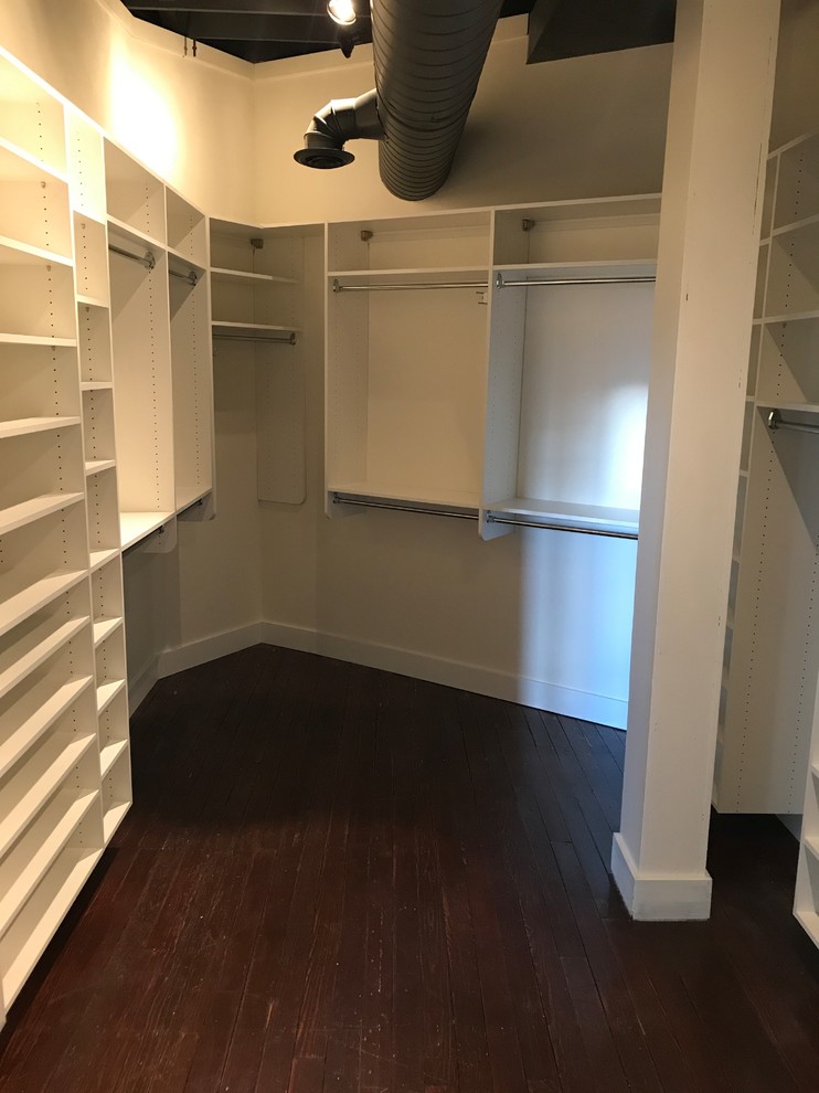 Walk-in closet - large traditional dark wood floor and brown floor walk-in closet idea in Detroit with white cabinets