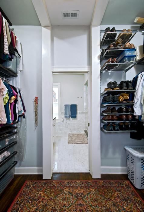 Design ideas for a medium sized traditional gender neutral walk-in wardrobe in DC Metro with open cabinets, white cabinets and dark hardwood flooring.