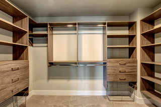 Big Walk in Closet with Beige and Light Wood Cabinets