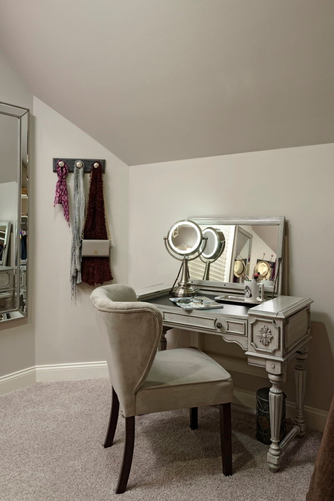 Design ideas for a large traditional dressing room for women in DC Metro with raised-panel cabinets and carpet.