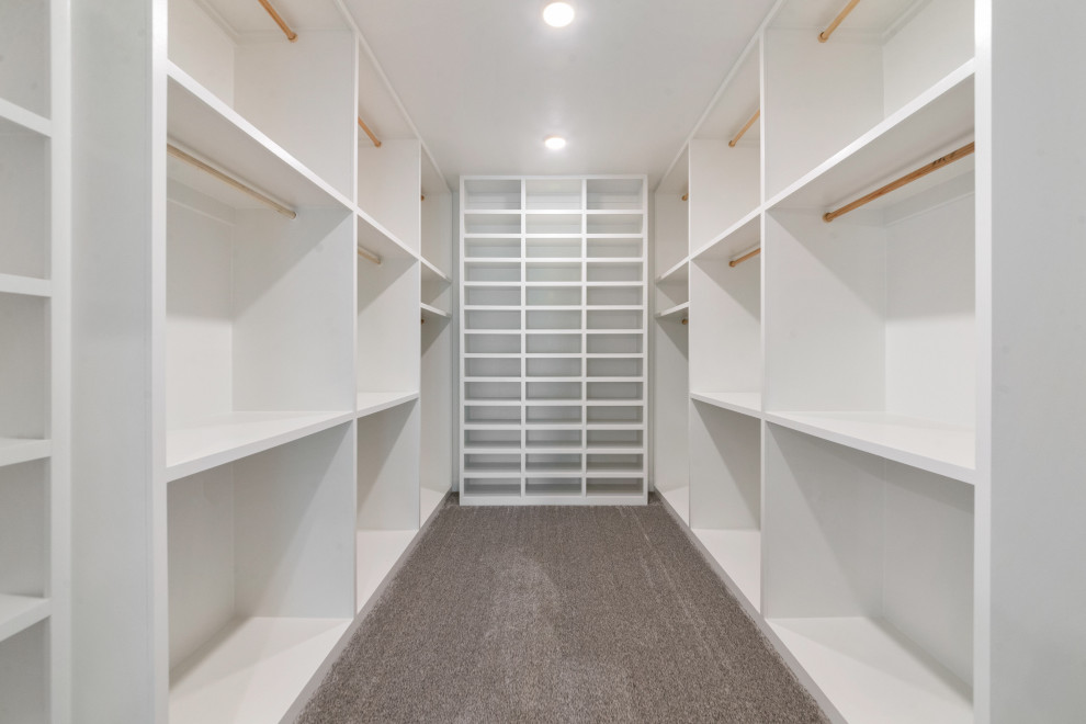 Design ideas for a medium sized contemporary gender neutral walk-in wardrobe in Dallas with open cabinets and white cabinets.