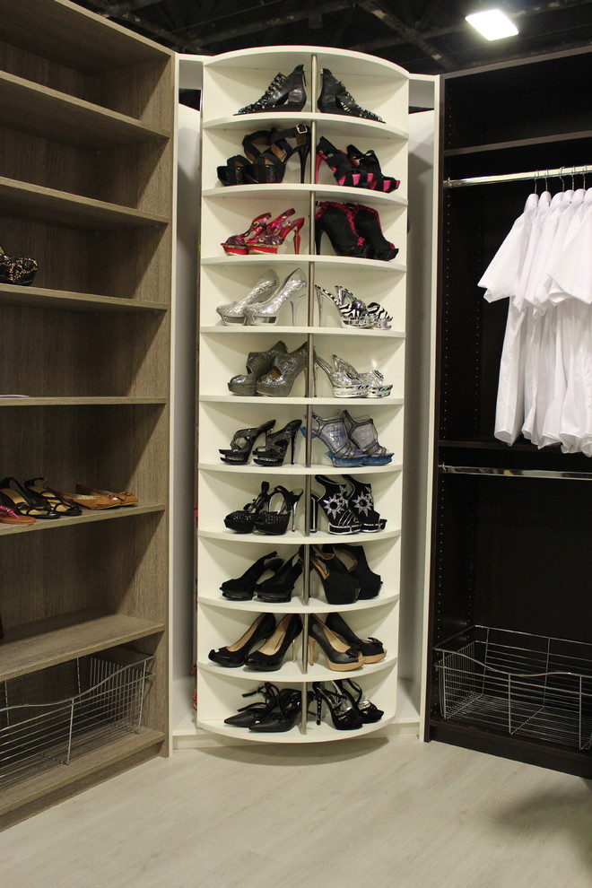 Example of a mid-sized trendy gender-neutral walk-in closet design in Miami