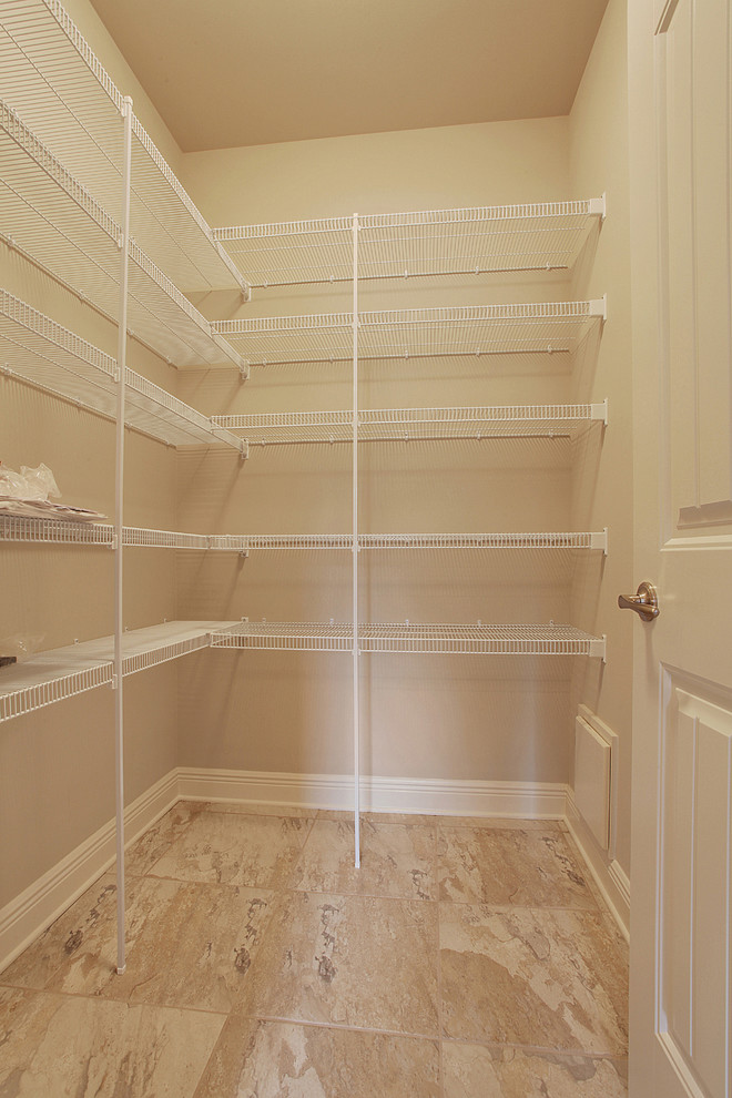 Design ideas for a classic walk-in wardrobe in New Orleans with ceramic flooring.