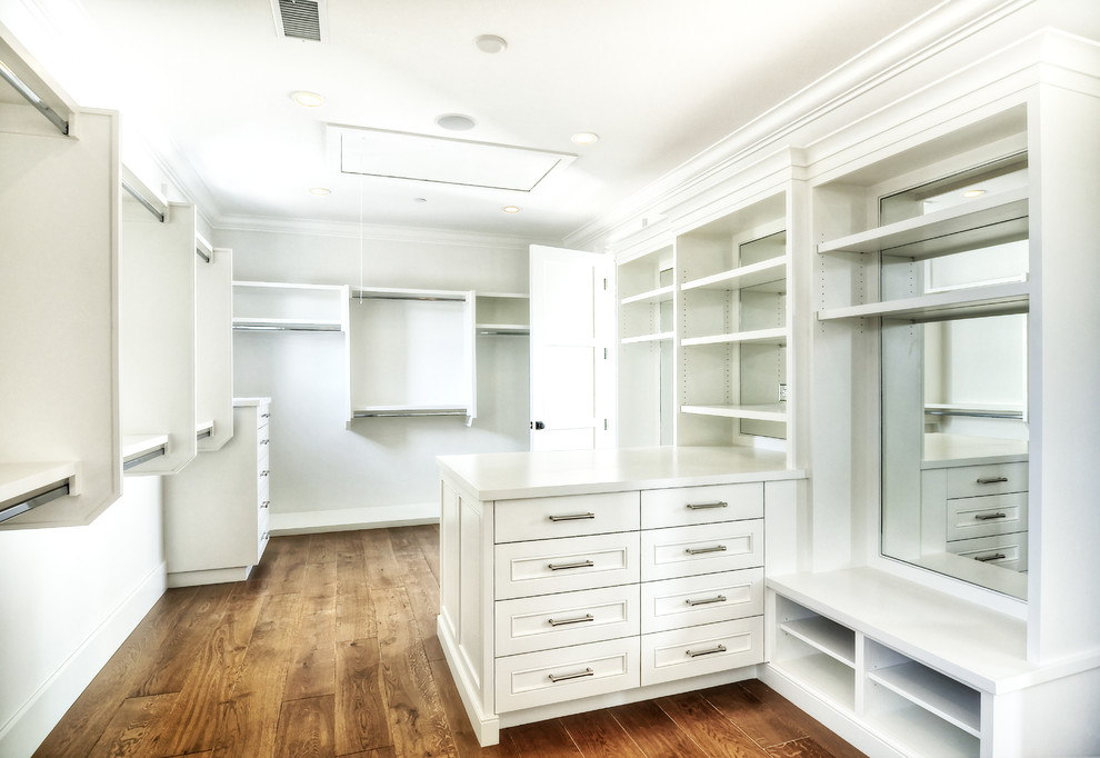 Example of a transitional closet design in Orange County