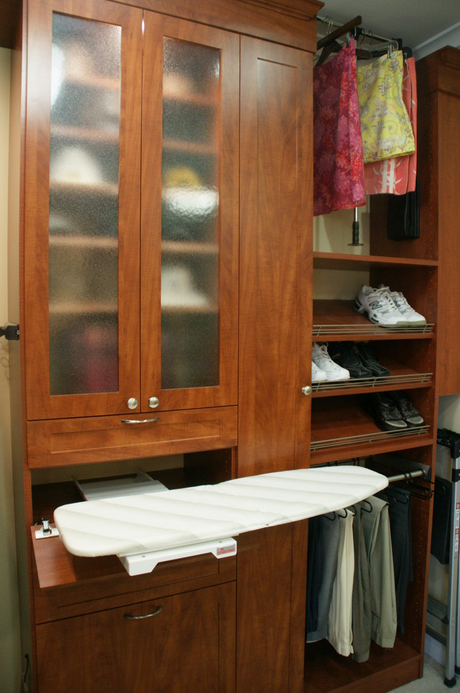 Inspiration for a medium sized classic dressing room for men in Atlanta with shaker cabinets and medium wood cabinets.