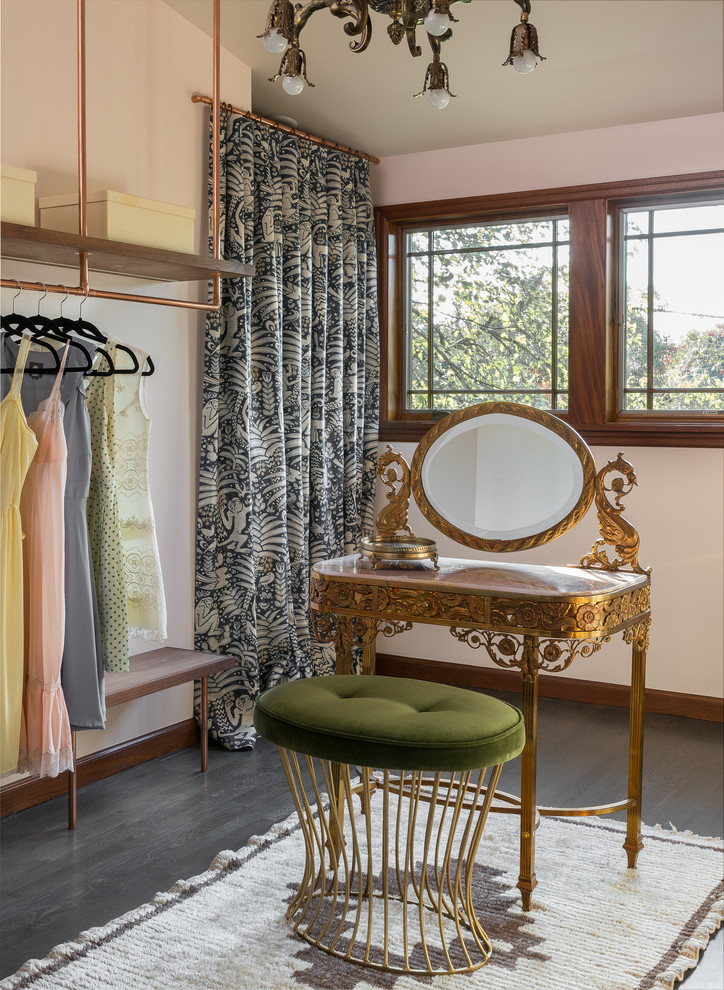 Inspiration for a traditional dressing room for women in Portland with dark hardwood flooring and grey floors.