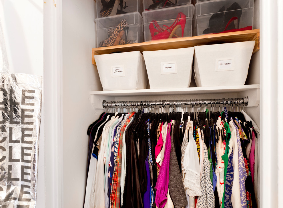 Reach-in closet - small traditional gender-neutral reach-in closet idea in New York