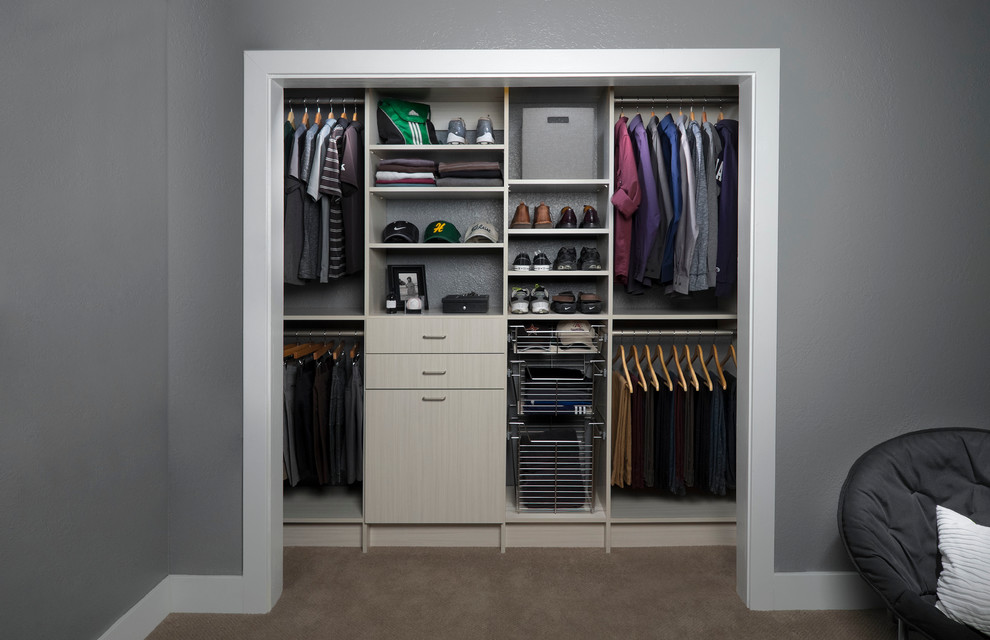 Inspiration for a small modern standard wardrobe for women in Toronto with flat-panel cabinets and grey cabinets.