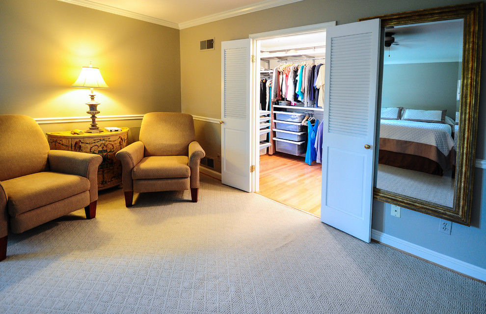 This is an example of a medium sized traditional gender neutral walk-in wardrobe in DC Metro with open cabinets and light hardwood flooring.