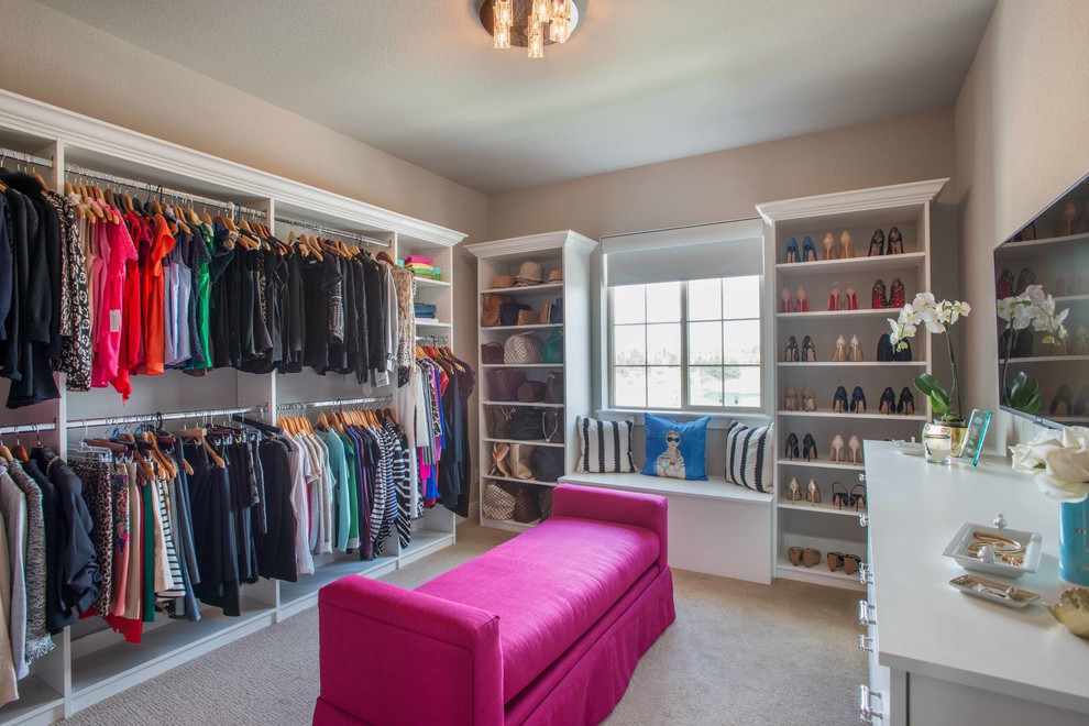 Example of a mid-sized minimalist women's carpeted walk-in closet design in Denver with flat-panel cabinets and white cabinets