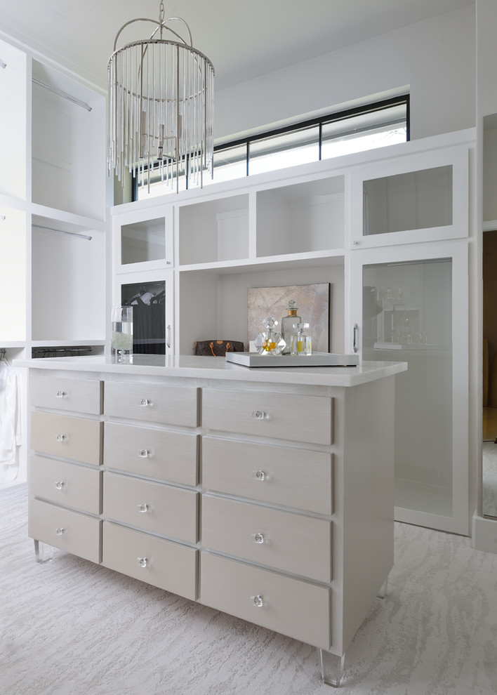 Inspiration for a large modern closet remodel in Houston