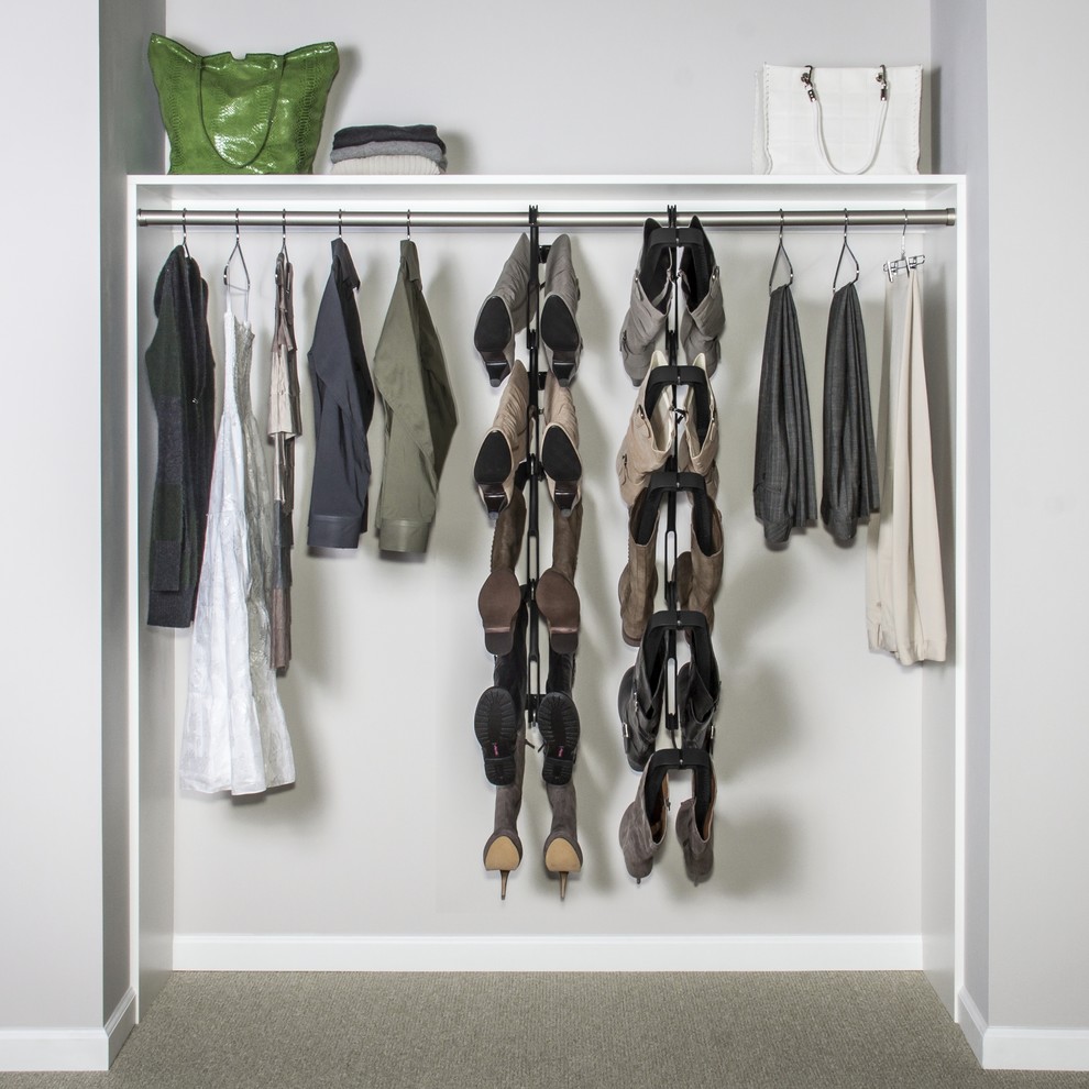 Inspiration for a small timeless gender-neutral carpeted reach-in closet remodel in New York