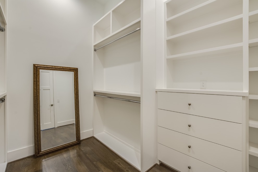 Inspiration for a medium sized retro gender neutral walk-in wardrobe with shaker cabinets, white cabinets, medium hardwood flooring and brown floors.