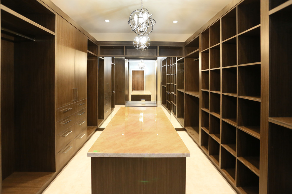 Inspiration for a huge asian gender-neutral carpeted walk-in closet remodel in Vancouver with open cabinets and dark wood cabinets