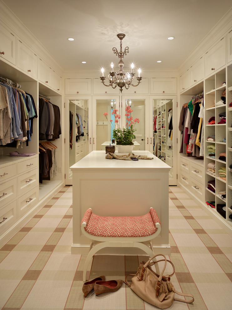 Example of a classic carpeted closet design in Seattle with beige cabinets
