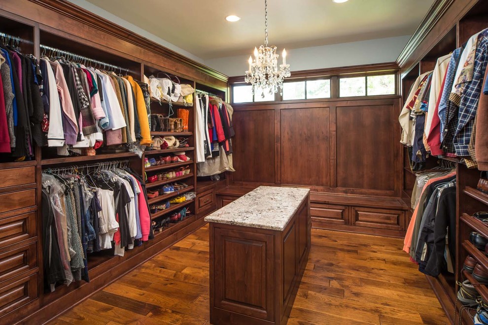 Large mountain style gender-neutral medium tone wood floor dressing room photo in Other with open cabinets and medium tone wood cabinets