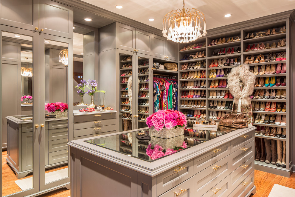 Mid-sized transitional women's medium tone wood floor dressing room photo in New York with recessed-panel cabinets and gray cabinets