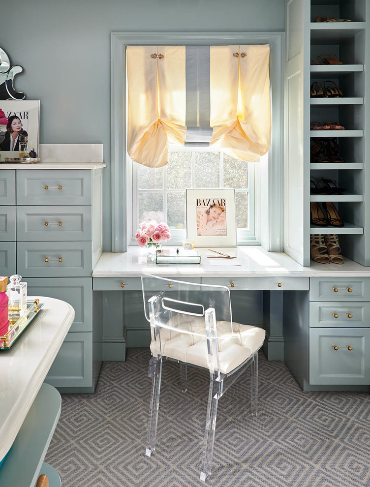 Example of a large classic women's carpeted and gray floor closet design in Charlotte with blue cabinets and open cabinets