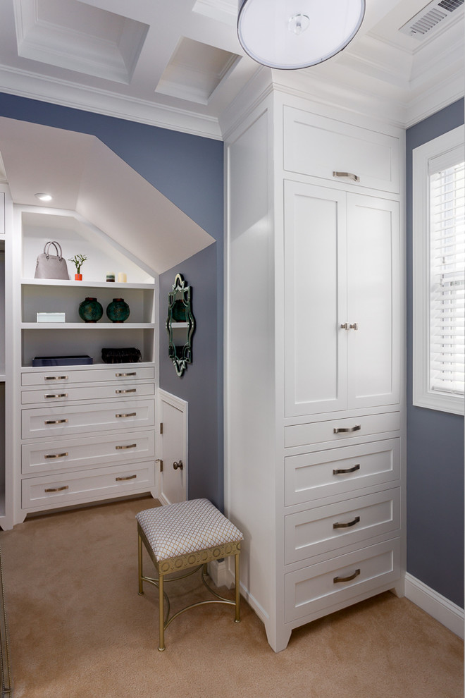 Example of a transitional carpeted dressing room design in Raleigh with shaker cabinets and white cabinets