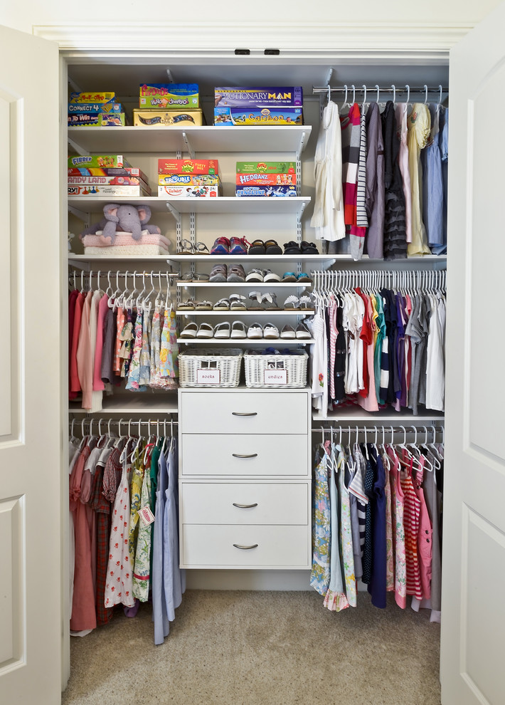 Elegant reach-in closet photo in Cincinnati with open cabinets and white cabinets