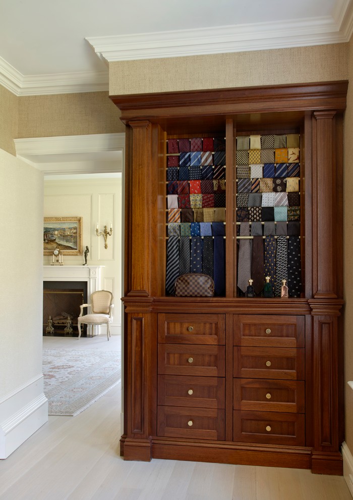 Closet - men's painted wood floor closet idea in Other with medium tone wood cabinets