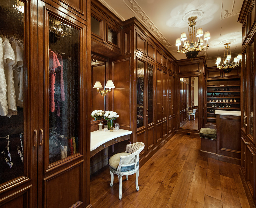Tuscan dressing room photo in Santa Barbara with recessed-panel cabinets and dark wood cabinets
