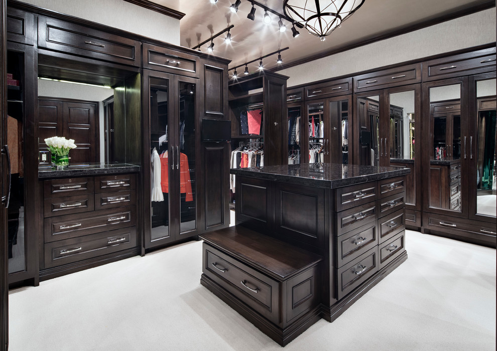 Design ideas for a large traditional gender neutral dressing room in Houston.
