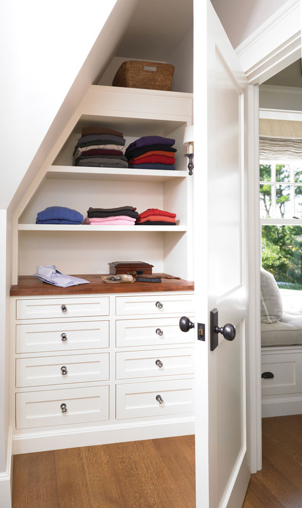 Inspiration for a timeless medium tone wood floor closet remodel in Boston