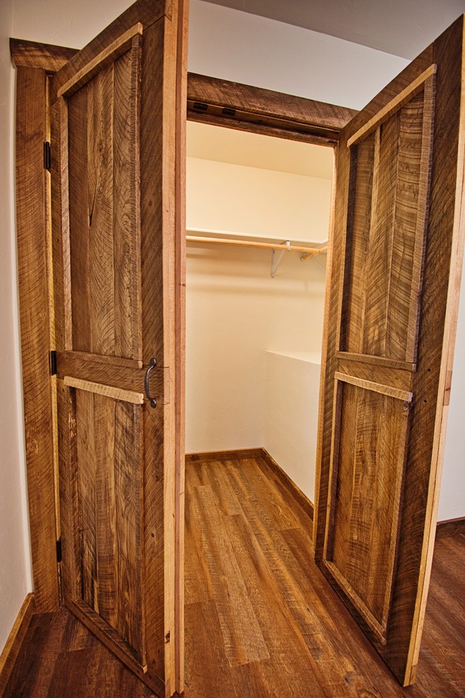 This is an example of a large rustic wardrobe in Other.