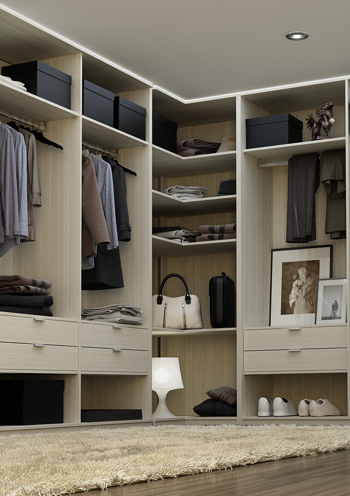 Imagen de armario vestidor unisex moderno grande con armarios con paneles lisos, suelo de madera oscura y puertas de armario beige