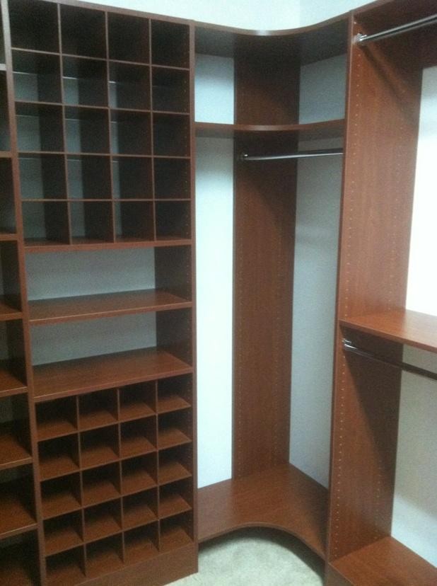 Closet - traditional gender-neutral carpeted closet idea in Birmingham with open cabinets and medium tone wood cabinets