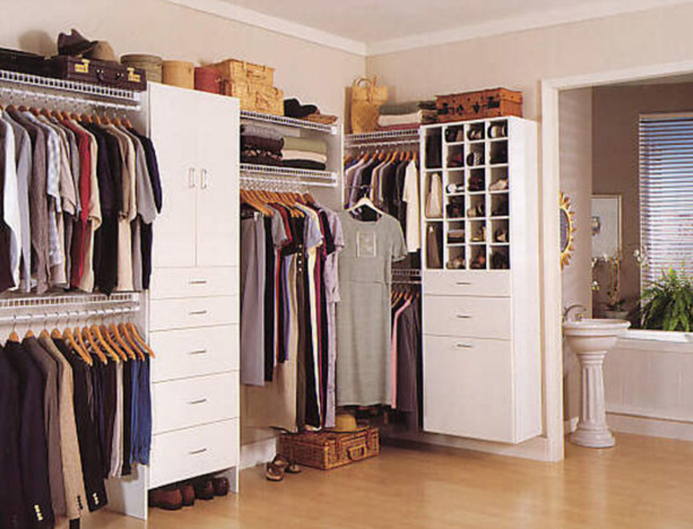Design ideas for a large contemporary gender neutral walk-in wardrobe in Other with open cabinets, white cabinets and carpet.