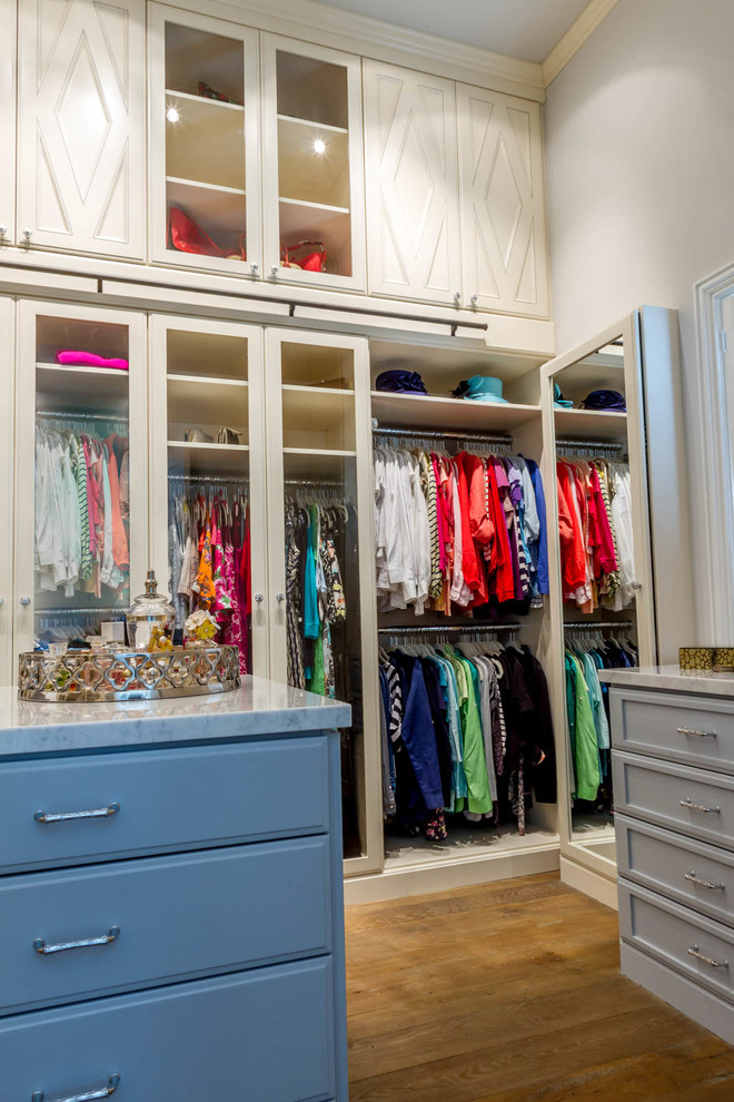Classic wardrobe for women in Houston with raised-panel cabinets.