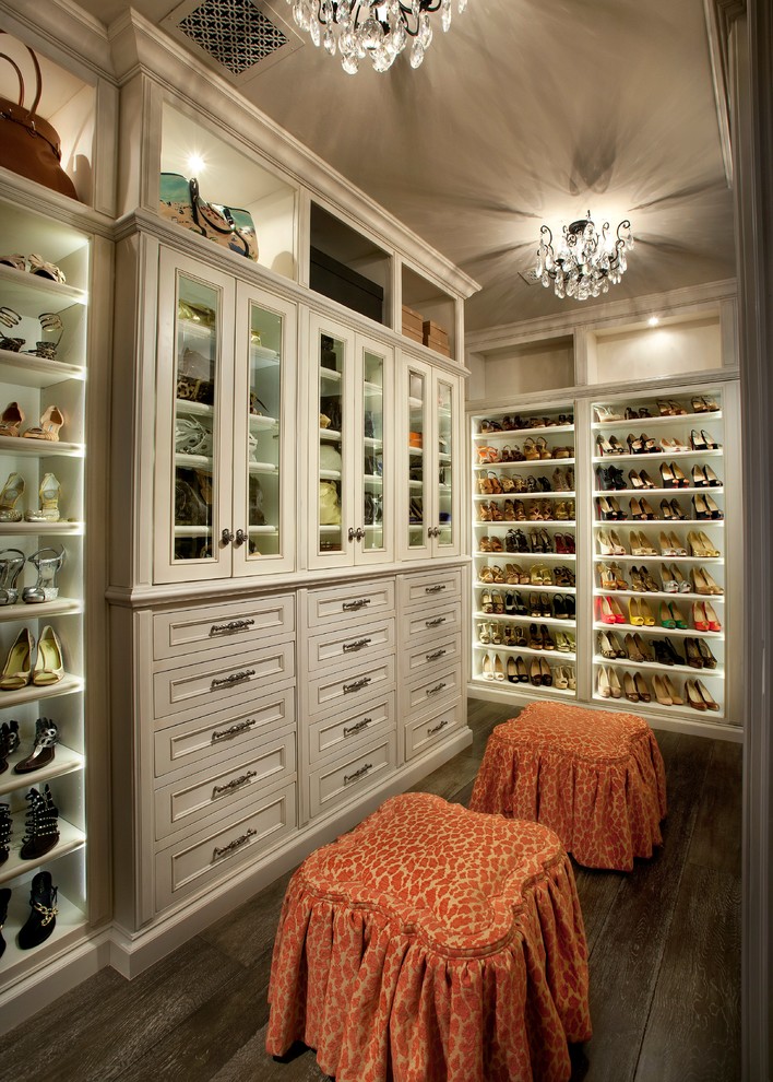 Inspiration for a timeless women's dark wood floor walk-in closet remodel in Phoenix with recessed-panel cabinets and beige cabinets