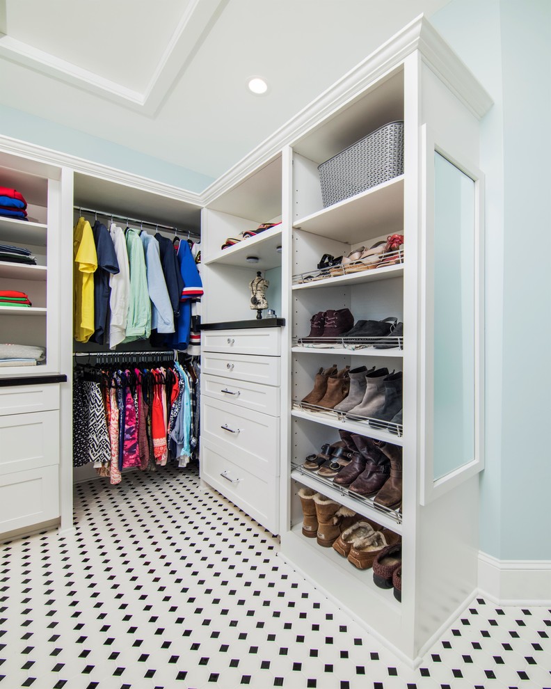 Example of a transitional closet design in Other