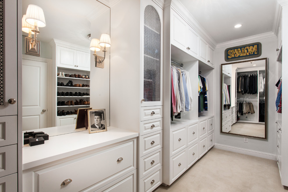 Traditional gender neutral wardrobe in Los Angeles with raised-panel cabinets, white cabinets, carpet and beige floors.