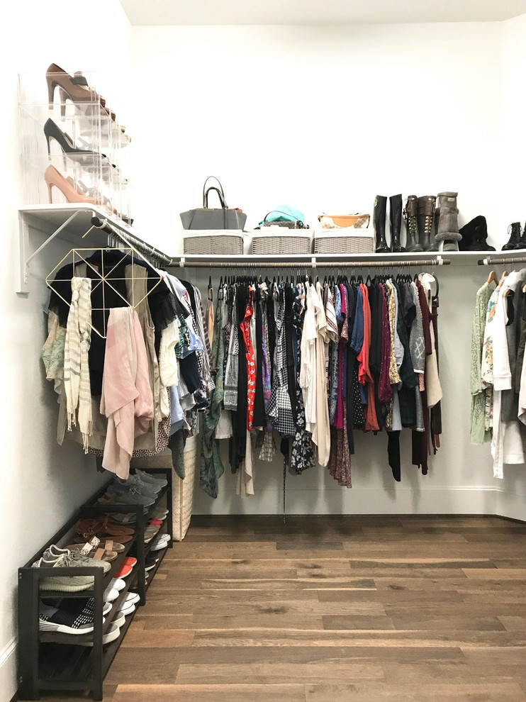 Inspiration for a medium sized traditional walk-in wardrobe for women in Houston with open cabinets, cork flooring and brown floors.