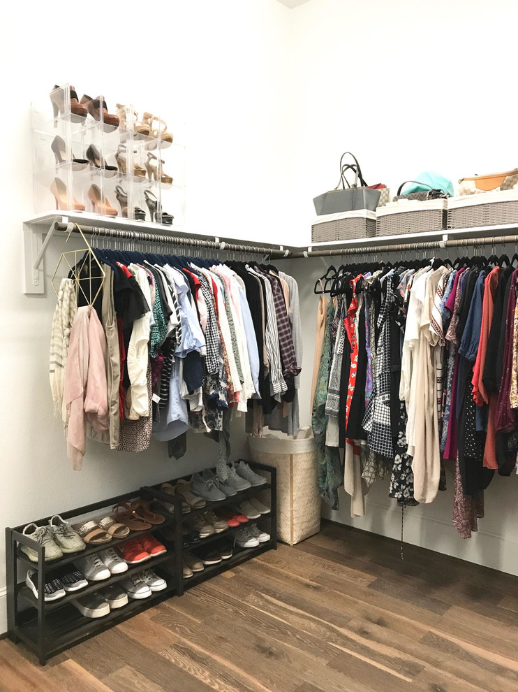 Inspiration for a medium sized classic walk-in wardrobe for women in Houston with open cabinets, cork flooring and brown floors.