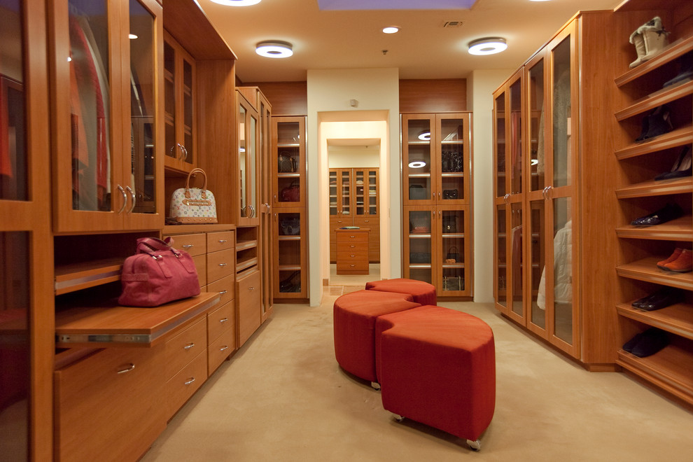 Inspiration for a contemporary dressing room in Las Vegas with medium wood cabinets.