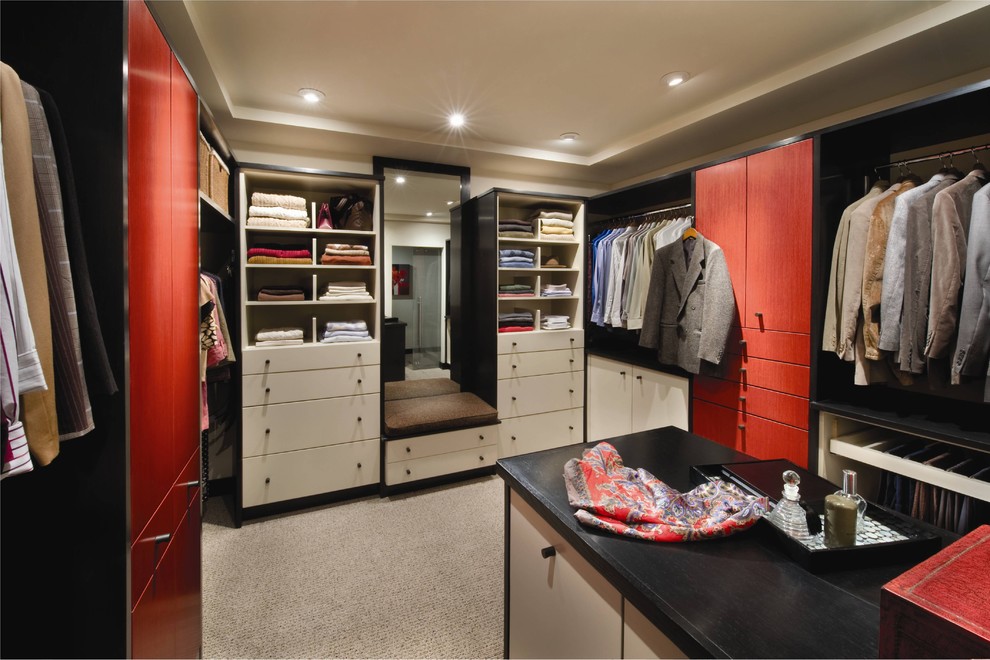 Photo of a large contemporary gender neutral walk-in wardrobe in Houston with flat-panel cabinets, white cabinets, carpet and beige floors.