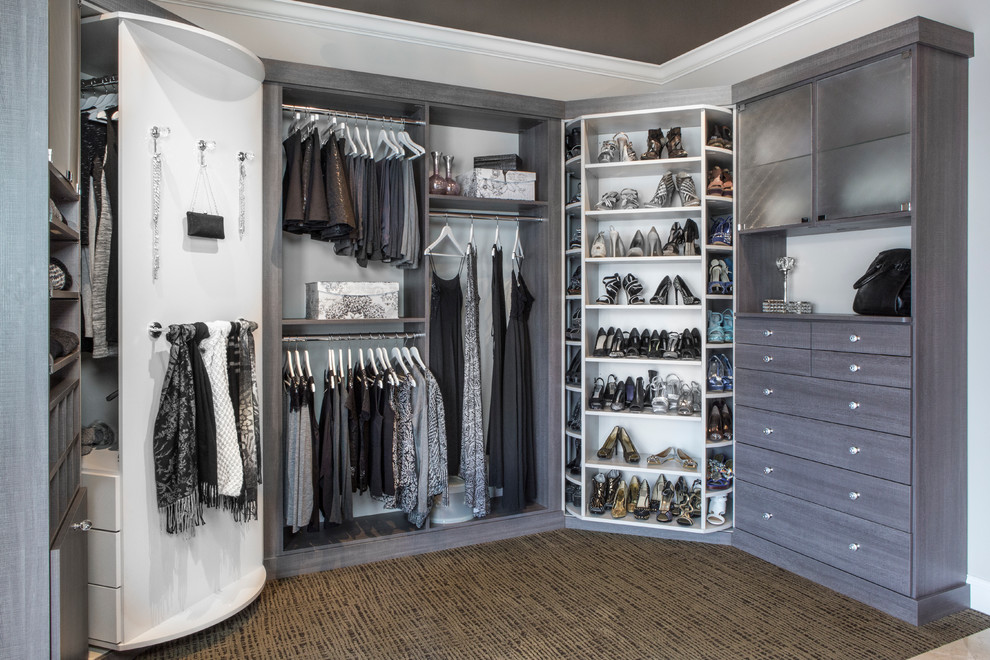 Example of a mid-sized classic women's carpeted and brown floor walk-in closet design in Chicago with flat-panel cabinets and gray cabinets