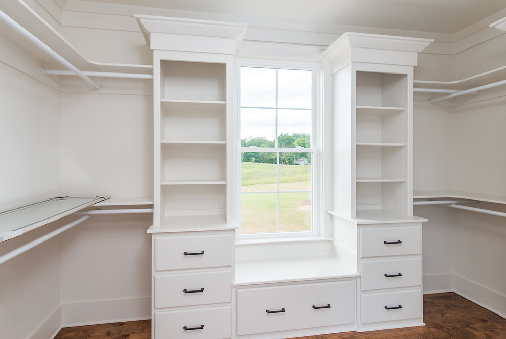 Design ideas for a medium sized country walk-in wardrobe in Other with white cabinets and medium hardwood flooring.